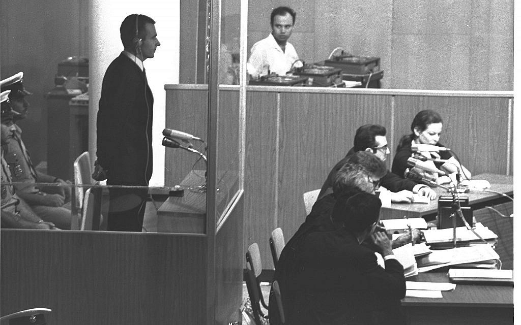 Denis Michael Rohan stands inside a bulletproof glass box at the opening session of his trial for setting fire to the al-Aqsa Mosque, at Binyanei Hauma convention center, Jerusalem, October 6, 1969. (Fritz Cohen/GPO)