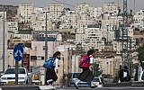 Illustrative: Ultra-Orthodox girls in Modiin Illit cross the street on their way to school, October 19, 2009. (Nati Shohat/Flash90)
