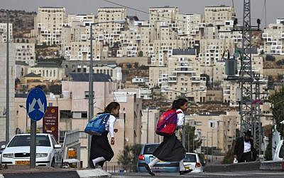 Illustrative: Ultra-Orthodox girls in Modiin Illit cross the street on their way to school, October 19, 2009. (Nati Shohat/Flash90)