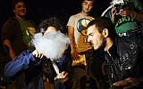 Illustrative: Young Israelis protest for the legalization of marijuana outside the Knesset in Jerusalem on April 20, 2014. (Matanya Tausig/Flash90)