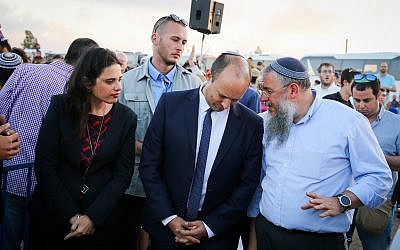 Education Minister Naftali Bennett and Justice Minister Ayelet Shaked at a rally to support residents, ahead of the expected evacuation and demolition of the illegal Jewish neighborhood of Netiv Ha'avot in the Etzion,  bloc on June 11, 2018. (Gershon Elinson/Flash90)