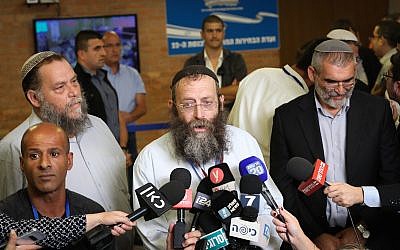 (From L-R) Benzi Gopstein, Baruch Marzel and Michael Ben-Ari from the Otzma Yehudit Party speak with the media outside the Central Elections Committee in Jerusalem, on August 1, 2019. (Noam Revkin Fenton/Flash90)