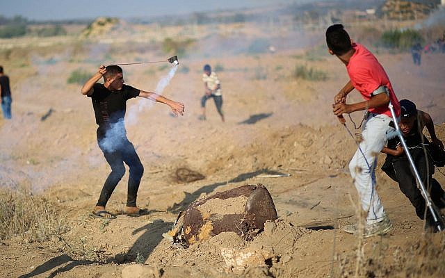 Palestinians protesters clash with Israeli forces during demonstrations at the Israel-Gaza border, near Shuja'iyya neighborhood of Gaza City, August 2, 2019 (Hassan Jedi/Flash90) Palestinians protesters clash with Israeli forces during demonstrations at the Israel-Gaza border, near Shuja'iyya neighborhood of Gaza City, August 2, 2019 (Hassan Jedi/Flash90)