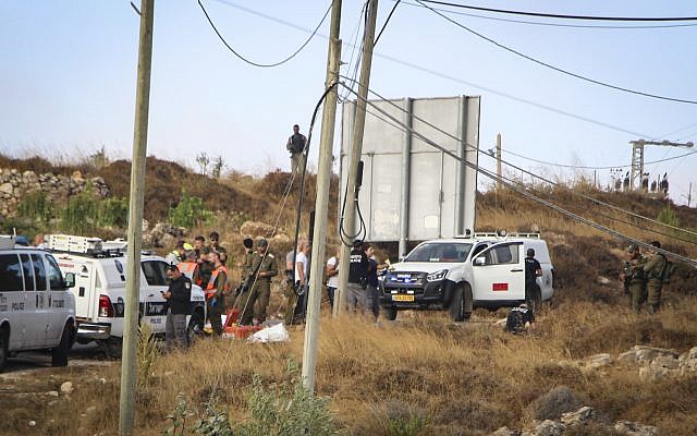 Israeli security forces at the scene where the body of an off-duty, out-of-uniform Israeli soldier was found dead with stab wounds, near the settlement of Migdal Oz in the Etzion region, on August 8, 2019. (Gershon Elinson/Flash90) Israeli security forces at the scene where the body of an off-duty, out-of-uniform Israeli soldier was found dead with stab wounds, near the settlement of Migdal Oz in the Etzion region, on August 8, 2019. (Gershon Elinson/Flash90)