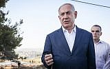 Prime Minister Benjamin Netanyahu at the scene where yeshiva student Dvir Sorek was killed in a West Bank terror attack, near the settlement of Migdal Oz in Gush Etzion, August 8, 2019. (Noam Revkin Fenton/Flash90)