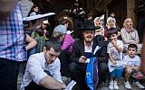 Jews pray as Muslims yell in Arabic God is Great outside the Temple Mount in the Old City of Jerusalem on August 11, 2019. (Hadas Parush/Flash90)