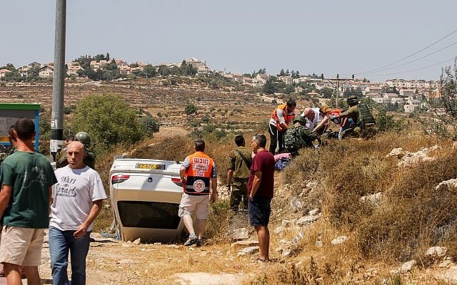 The scene of a suspected car-ramming attack outside Elazar in the West Bank on August 16, 2019 (Gershon Elinson/Flash90) The scene of a suspected car-ramming attack outside Elazar in the West Bank on August 16, 2019 (Gershon Elinson/Flash90)
