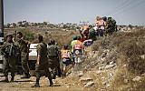 The scene of a car-ramming attack outside the West Bank settlement of Elazar on August 16, 2019. (Gershon Elinson/Flash90)