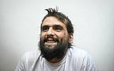 Telegrass founder Amos Dov Silver appears at the Rishon Lezion Magistrate's Court for a remand hearing on August 18, 2019, after being extradited to Israel from Ukraine. (Avi Dishi/Flash90)