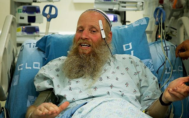 Rabbi Eitan Shnerb speaks to the media at the Hadassah Medical Center Ein Kerem, a day after being wounded in a terrorist bombing near Dolev that killed his daughter Rina and wounded his son Dvir, August 24, 2019. (Flash90) Rabbi Eitan Shnerb speaks to the media at the Hadassah Medical Center Ein Kerem, a day after being wounded in a terrorist bombing near Dolev that killed his daughter Rina and wounded his son Dvir, August 24, 2019. (Flash90)