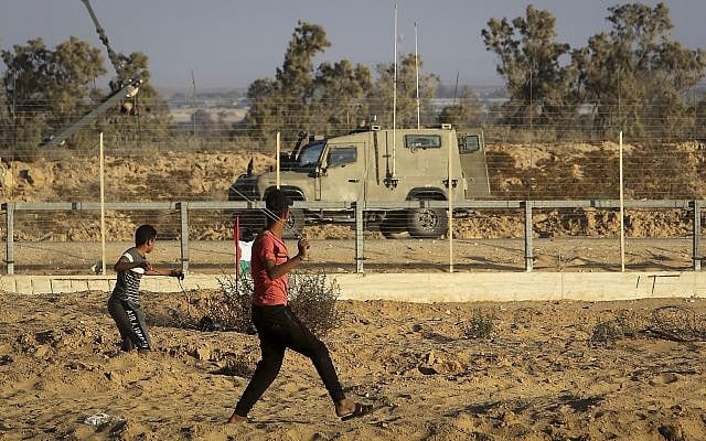 Palestinians clash with Israeli forces along the border between the Gaza Strip and Israel, east of Rafah, on August 30, 2019. (Abed Rahim Khatib/Flash90) Palestinians clash with Israeli forces along the border between the Gaza Strip and Israel, east of Rafah, on August 30, 2019. (Abed Rahim Khatib/Flash90)