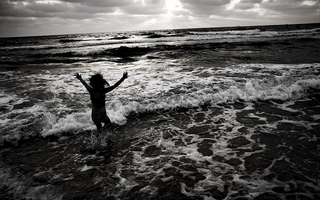 One of Tal Paz-Fridman's works of people, titled 'Pure Joy' showing how people look when they interact with the natural world. 'It always amazes me how small we are compared to our world and how important it is to protect our environment, far more than any difference in opinion, argument, or local conflict.' (Courtesy Tal Paz-Fridman)