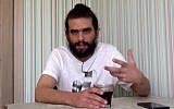 Telegrass founder Amos Dov Silver speaks in an interview with the Kan public broadcaster aired on July 20, 2019, from where he was being held under arrest in Ukraine. (Screen capture: YouTube)