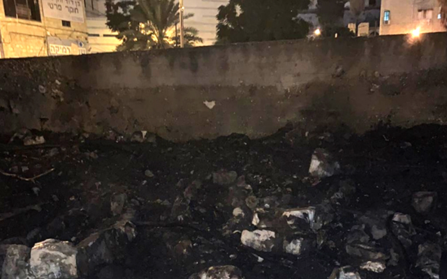 The wall of a Muslim cemetery in Haifa that was torched in a suspected arson attack on August 23, 2019. (Israel Police) The wall of a Muslim cemetery in Haifa that was torched in a suspected arson attack on August 23, 2019. (Israel Police)