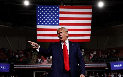 US President Donald Trump reacts at the end of a speech at a campaign rally, Aug. 15, 2019, in Manchester, New Hampshire. (AP Photo/Patrick Semansky)