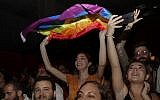 A girl waves a rainbow flag during a concert organized in solidarity with Lebanese indie band Mashrou' Leila in Lebanon's capital Beirut, August 9, 2019. (Anwar Amro/AFP)