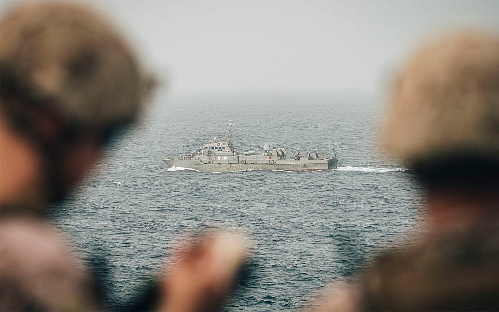 US Marines monitor an Iranian navy vessel from the USS John P. Murtha in the Strait of Hormuz, August 12, 2019. (US Marine Corps photo by Staff Sgt. Donald Holbert/Released) US Marines monitor an Iranian navy vessel from the USS John P. Murtha in the Strait of Hormuz, August 12, 2019. (US Marine Corps photo by Staff Sgt. Donald Holbert/Released)
