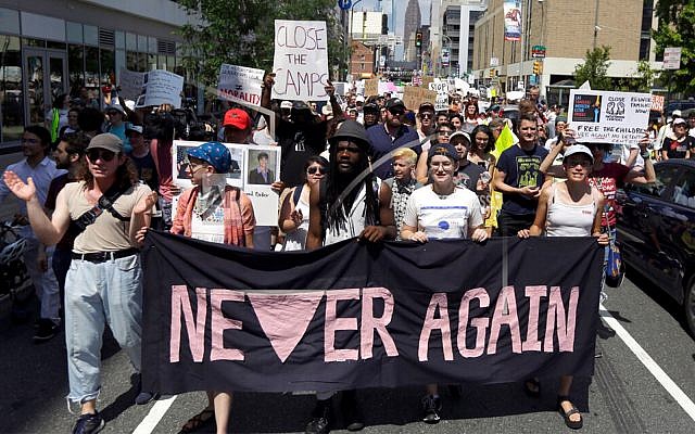 Protesters assembled by a majority Jewish group called Never Again Is Now walk through traffic as they make their way to Independence Mall in Philadelphia, July 4, 2019. (AP Photo/Jacqueline Larma, File) Protesters assembled by a majority Jewish group called Never Again Is Now walk through traffic as they make their way to Independence Mall in Philadelphia, July 4, 2019. (AP Photo/Jacqueline Larma, File)