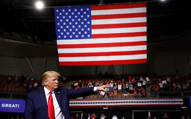 US President Donald Trump reacts at the end of his speech at a campaign rally, August 15, 2019, in Manchester, New Hampshire. (AP Photo/Patrick Semansky)