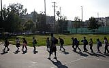 Illustrative: a group of students walk to their classroom at Kingsley Elementary School in Los Angeles, California, January 13, 2015. (AP Photo/Jae C. Hong)