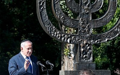 Prime Minister Benjamin Netanyahu speaks at the Babi Yar ravine, where Nazi troops murdered thousands of Jews during WWII, in Kyiv, Ukraine, August 19, 2019. (AP Photo/Efrem Lukatsky)