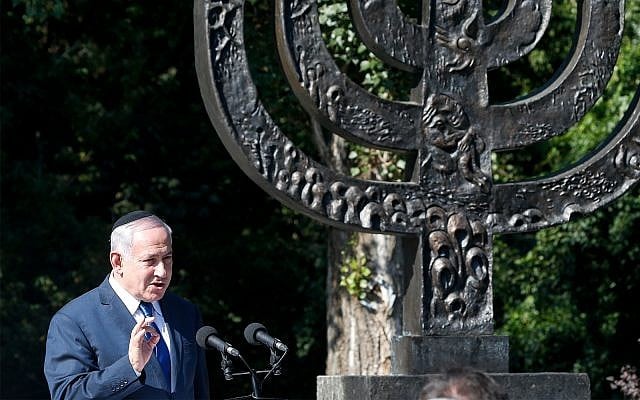 Prime Minister Benjamin Netanyahu speaks at the Babi Yar ravine, where Nazi troops murdered thousands of Jews during WWII, in Kyiv, Ukraine, August 19, 2019. (AP Photo/Efrem Lukatsky) Prime Minister Benjamin Netanyahu speaks at the Babi Yar ravine, where Nazi troops murdered thousands of Jews during WWII, in Kyiv, Ukraine, August 19, 2019. (AP Photo/Efrem Lukatsky)