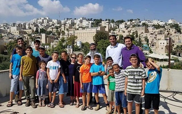 Settlers stand at the top of the Machpela House in Hebron after re-entering the building for the first time in months on August 25, 2019. (Harhivi movement) Settlers stand at the top of the Machpela House in Hebron after re-entering the building for the first time in months on August 25, 2019. (Harhivi movement)