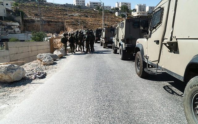 Illustrative: IDF troops conduct search operations around the Palestinian village of Beit Fajjar, near Bethlehem, in the West Bank, on August 8, 2019. (Israel Defense Forces) Illustrative: IDF troops conduct search operations around the Palestinian village of Beit Fajjar, near Bethlehem, in the West Bank, on August 8, 2019. (Israel Defense Forces)