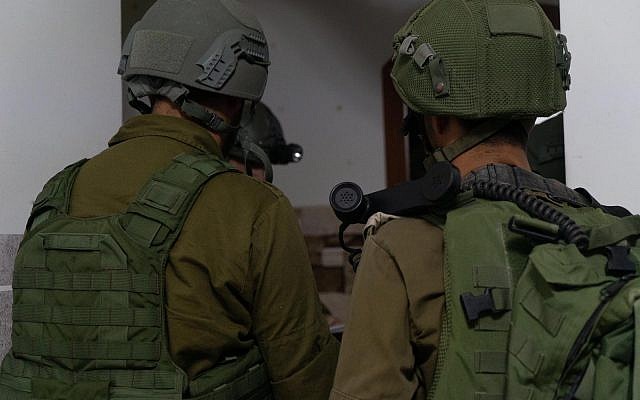 Israeli troops measure the homes of two Palestinians suspected of killing Dvir Sorek, ahead of their planned demolition in the village of Beit Kahil in the southern West Bank on August 12, 2019. (Israel Defense Forces) Israeli troops measure the homes of two Palestinians suspected of killing Dvir Sorek, ahead of their planned demolition in the village of Beit Kahil in the southern West Bank on August 12, 2019. (Israel Defense Forces)