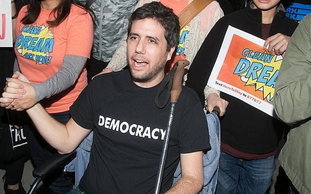Ady Barkan attends the Los Angeles Supports a Dream Act Now! protest at the office of California Senator Dianne Feinstein on January 3, 2018 in Los Angeles, California. (Gabriel Olsen/Getty Images via JTA) Ady Barkan attends the Los Angeles Supports a Dream Act Now! protest at the office of California Senator Dianne Feinstein on January 3, 2018 in Los Angeles, California. (Gabriel Olsen/Getty Images via JTA)