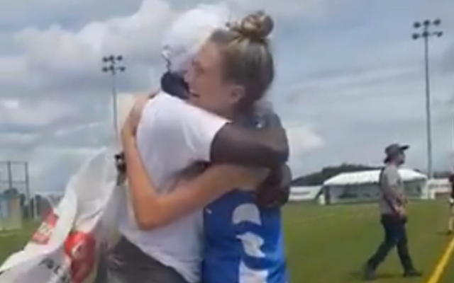 Israel and Kenyan lacrosse players embrace after the Israeli team gifts its opponents with new cleated shoes, August 7, 2019 (video screenshot) Israel and Kenyan lacrosse players embrace after the Israeli team gifts its opponents with new cleated shoes, August 7, 2019 (video screenshot)