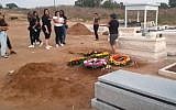 Thousands attend joint funeral of Tahel Maul, 16, and her older sister Yarin, 19, at Ashkelon's Giv'at Zion cemetery, August 29, 2019 (Screen grab from newsenders via Israel Hayom)