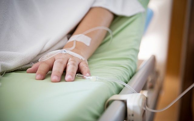 An illustrative image of a patient getting treatment (kckate16; iStock by Getty Images)