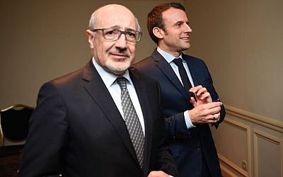 The president of the French Jewish group CRIF, Francis Kalifat, left, with presidential candidate Emmanuel Macron at the Grand Hotel Intercontinental in Paris, March 22, 2017. (Eric Feferberg/AFP/Getty Images)