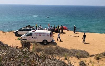 Rescuers at the scene of a paraglider crash the killed one person and wounded another, atop a seaside cliff near Herzliya, August 28, 2019. (Magen David Adom)