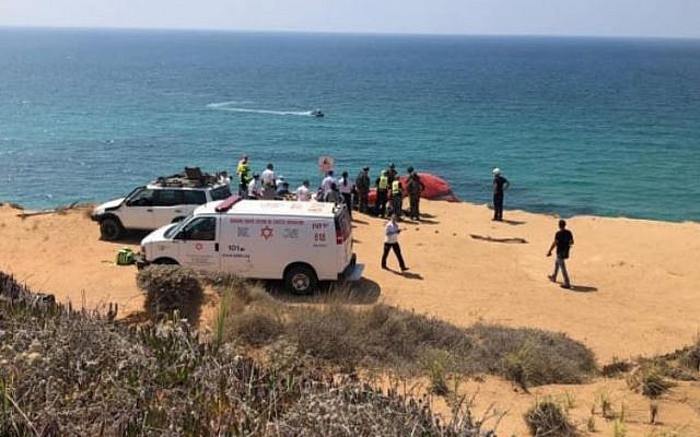 Rescuers at the scene of a paraglider crash the killed one person and wounded another, atop a seaside cliff near Herzliya, August 28, 2019. (Magen David Adom) Rescuers at the scene of a paraglider crash the killed one person and wounded another, atop a seaside cliff near Herzliya, August 28, 2019. (Magen David Adom)