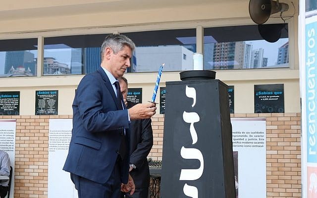 Israel's ambassador to Panama, Reda Mansour, lights a candle in memory of Israel's fallen soldiers and terror victims, May 8, 2019 (Facebook page of Israeli Embassy in Panama) Israel's ambassador to Panama, Reda Mansour, lights a candle in memory of Israel's fallen soldiers and terror victims, May 8, 2019 (Facebook page of Israeli Embassy in Panama)