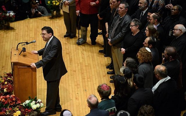 Rabbi Jonathan Perlman speaks to thousands at the Soldiers and Sailors Memorial Hall during a service to honor and mourn the victims of the mass shooting at the Tree Of Life Synagogue, in Pittsburgh on October 28, 2018. (Jeff Swensen/Getty Images via JTA) Rabbi Jonathan Perlman speaks to thousands at the Soldiers and Sailors Memorial Hall during a service to honor and mourn the victims of the mass shooting at the Tree Of Life Synagogue, in Pittsburgh on October 28, 2018. (Jeff Swensen/Getty Images via JTA)
