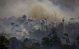 Smokes rises from forest fires in Altamira, Para state, Brazil, in the Amazon basin, on August 27, 2019. (Joao Laet / AFP)