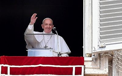 Pope Francis waves from the window of the apostolic palace overlooking St. Peter's square during the weekly Angelus prayer on September 1, 2019 at the Vatican. (Photo by Tiziana FABI / AFP)