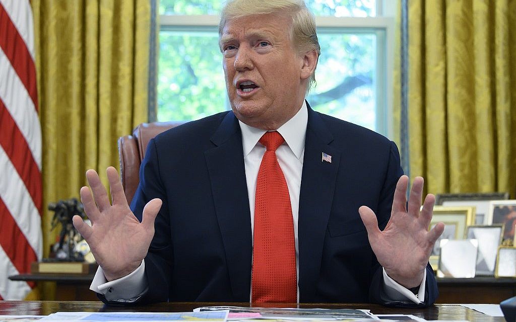 US President Donald Trump updates the media on Hurricane Dorian preparedness from the Oval Office at the White House in Washington, DC, September 4, 2019. (Photo by JIM WATSON / AFP)