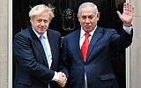 Britain's Prime Minister Boris Johnson (L) greets Prime Minister Benjamin Netanyahu outside 10 Downing Street in central London on September 5, 2019. (DANIEL LEAL-OLIVAS / AFP)