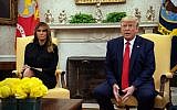 US President Donald Trump, with First Lady Melania Trump, speaks to the press in the Oval Office at the White House in Washington, on September 11, 2019. (Nicholas Kamm/AFP)