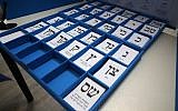Ballots lies on a table during Israel's parliamentary election, at a polling station in Rosh Haayin, on September 17, 2019. (Jack GUEZ/AFP)