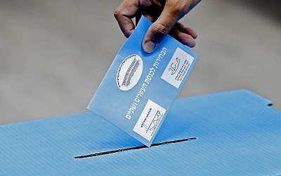 An Israeli man casts his ballot during Israel's parliamentary elections at a polling station in Rosh Haayin, on September 17, 2019. (Jack Guez/AFP)