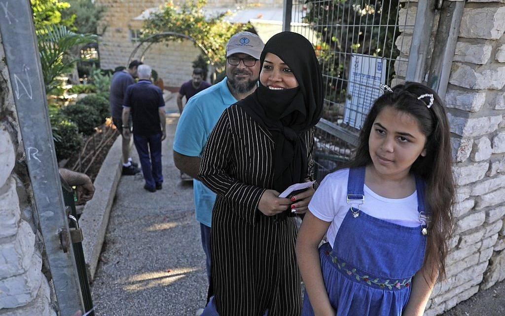 Illustrative. Arab Israeli arrive at polling station in Haifa during Israel's parliamentary election, on September 17, 2019. (Ahmad GHARABLI/ AFP) Illustrative. Arab Israeli arrive at polling station in Haifa during Israel's parliamentary election, on September 17, 2019. (Ahmad GHARABLI/ AFP)