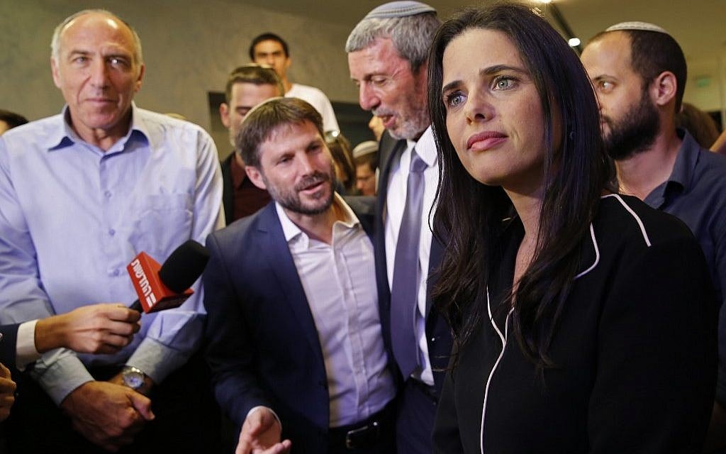 Ayelet Shaked (R), leader and candidate of the New Right party that is part of the Yamina political alliance, speaks to the press while flanked by Jewish Home member and candidate Moti Yogev (L), National Union party leader and candidate Bezalel Smotrich (2nd-L), (Gil Cohen-Magen/AFP)