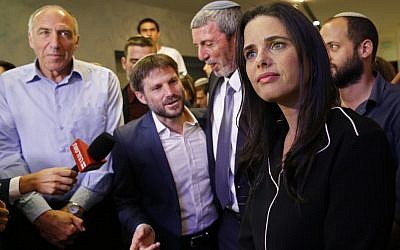Ayelet Shaked (R), leader and candidate of the New Right party that is part of the Yamina political alliance, speaks to the press while flanked by Jewish Home member and candidate Moti Yogev (L), National Union party leader and candidate Bezalel Smotrich (2nd-L), (Gil Cohen-Magen/AFP)