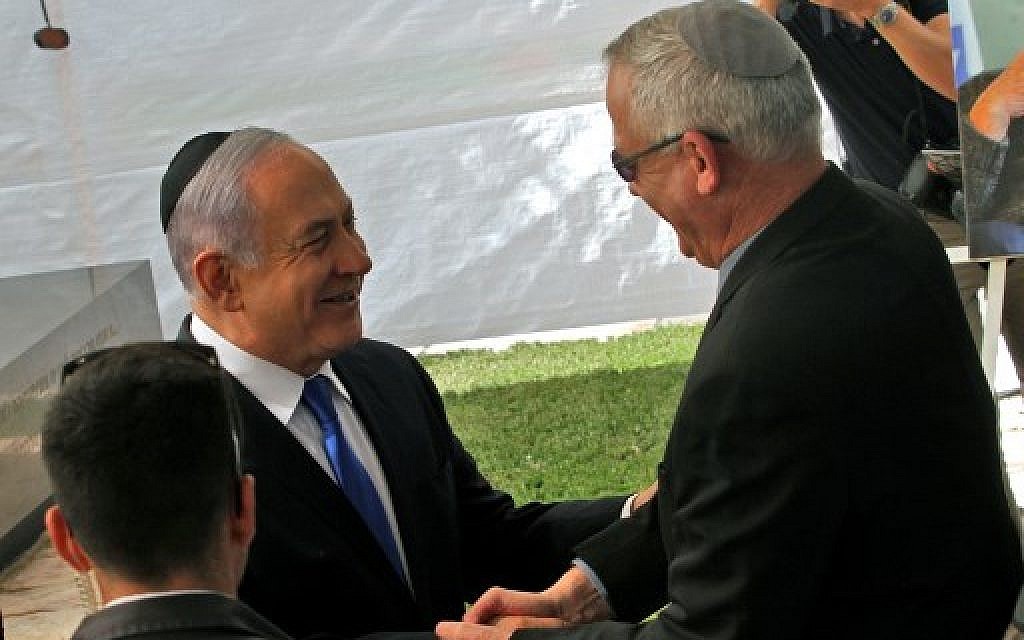 Prime Minister Benjamin Netanyahu (L) greets Blue and White leader Benny Gantz at a memorial ceremony for late Israeli president Shimon Peres on Mount Herzl in Jerusalem on September 19, 2019. (Gil Cohen-Magen/AFP) Prime Minister Benjamin Netanyahu (L) greets Blue and White leader Benny Gantz at a memorial ceremony for late Israeli president Shimon Peres on Mount Herzl in Jerusalem on September 19, 2019. (Gil Cohen-Magen/AFP)