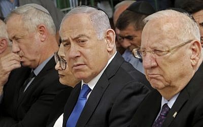President Reuven Rivlin, right, Prime Minister Benjamin Netanyahu, center, and Blue and White leader Benny Gantz, left, at a memorial ceremony for the late president Shimon Peres, at Mount Herzl in Jerusalem, on September 19, 2019. (Gil Cohen-Magen/AFP)